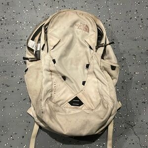 North face cream and pink backpack